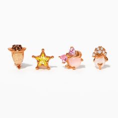 three rings with different colored stones on each one and a small star in the middle