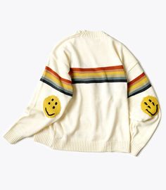 A 5g knit crewneck sweater with a rainbow stripe and smiley elbow patches. Made of 59% cotton, 36% acrylic, 5% wool Sizing Size 1 - Length: 24.75in. Shoulder: 21.25in. Sleeve length: 22inSize 3 - Length: 26in. Shoulder: 22.5in. Sleeve length: 23.25in Made by Made in Japan by Kapital Knit Rainbow, Silly Clothes, Bright Outfits, Rainbow Outfit, Weird Fashion, Sweater White, Elbow Patches, Knit Crewneck, Rainbow Stripes