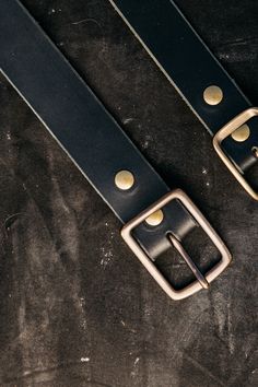 Simple, durable and works with everything. Hand made in our California shop of high quality 8oz American latigo leather, with a solid brass buckle. True to size, will soften and patina with wear. 1.75" thick leather strap. Adjustable Leather Belt Buckles With Brass Hardware, Classic Leather Strap Belts For Everyday Use, Classic Leather Strap Belt For Everyday Use, Classic Belts With Leather Strap For Everyday Use, Black Leather Belt Buckle With Brass Detail, Everyday Leather Belts With Brass Hardware, Classic Black Belt With Brass Hardware, Adjustable Bridle Leather Belt With Brass Buckle, Classic Black Belt With Brass Buckle