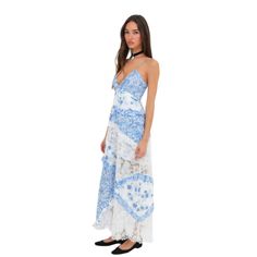 Revive your wardrobe with our floral maxi dress, featuring a retro-inspired design with '70s charm. This dress boasts a plunging neckline, mixed print paneling, and floral lace with ruffles. The A-line silhouette provides a comfortable fit, and the dress is crafted from sustainable materials, making it an elegant yet eco-conscious choice for any occasion. Features Fit: Fitted through the bust with a A-line silhouette for a flattering shape. Design: Mixed print paneling and floral lace with ruffle details for a vintage-inspired look. Adjustability: Skinny shoulder ties and cross-back ties for a customizable fit. Closure: Invisible zipper closure at the center-back for a seamless finish. Fabric: Made from 100% recycled polyester, with contrast fabric of 54% cotton and 46% nylon. Lining is 98 Corset Shapewear, Sleeveless Short Dress, Dress Robes, Knit Set, Mixing Prints, Cozy Knits, Eco Conscious, Sustainable Materials, Floral Maxi