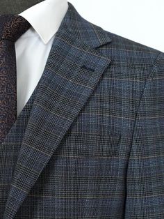 Men's suits are the ultimate in formal wear, designed to make a statement of sophistication and style. Whether you prefer a classic or slim fit, a tailored or bespoke suit, there's a perfect suit for every occasion. With single-breasted or double-breasted styles, notch or peak lapels, and solid colors or checkered and herringbone patterns, you can create a suit that's uniquely yours. For the most formal occasions, a tuxedo or dinner jacket will make you stand out from the crowd. And for a three- Luxury Fitted Sport Coat For Business, Luxury Fitted Business Sport Coat, Luxury Custom Fit Suits With Welt Pockets, Business Casual Custom Fit Suits, Custom Fit Three-piece Suit For Business, Luxury Custom Fit Blazer For Business, Fitted Dapper Business Suit, Fitted Dapper Blazer For Business, Custom Fit Double Breasted Suit For Business