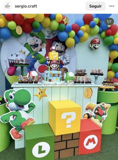 an image of a mario birthday party with balloons on the wall and decorations around it