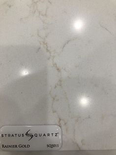 a white marble counter top with the name stratusquartz on it