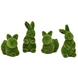 four small green rabbits sitting next to each other