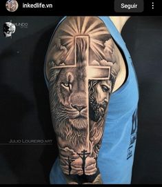 a man with a cross and lion tattoo on his arm