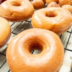 there are many donuts on the cooling rack