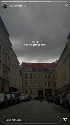 a street with cars parked on both sides and a message written in the middle that reads, to hate and it's getting dark