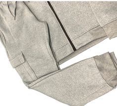 Upgrade your workout wardrobe with our Men Fleece Jogger Outfit. Stay warm and cozy in the soft fleece material. Featuring utility cargo pockets, perfect for storing essentials during your workout. Complete the set with our matching sweat jacket. Get the ultimate comfort and convenience with this sweatpants and jacket combo. About this item1.Matching 2-piece Fleece jogging suit with jogger sweatpants and fleece sweat jacket2.Sweatpants with cargo pockets on both sides, 2 side pockets and a back Athleisure Tracksuit With Pockets For Outdoor, Athleisure Outdoor Tracksuit With Pockets, Winter Tracksuit With Pockets Sportswear, Winter Sportswear Tracksuit With Pockets, Casual Outdoor Tracksuit With Pockets, Casual Tracksuit With Pockets For Outdoor, Fall Sportswear Tracksuit With Pockets, Winter Tracksuit With Side Pockets And Sportswear Style, Fall Athleisure Tracksuit With Side Pockets