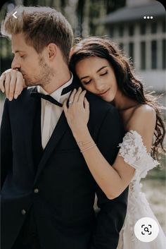 a man in a tuxedo and woman in a wedding dress embracing each other