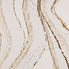 an abstract marble pattern with brown and white streaks on the top right side, in shades of gold