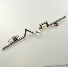 "An amazing one of a kind sterling silver artisan brooch circa 1980 set with a polished doubly terminated natural amethyst crystal and a gorgeous faceted rhodolite garnet.  It weighs 10.4 grams.  This piece measures approximately 5 3/8\" long by 5/8\" deep by 5/8\" wide (136mm x 16mm x 16mm).  It is in great condition ready to gift or to wear.  The photos are part of the description of this artisan brooch.  It will be sent in a presentation box ready for gifting." Memphis Jewelry, Mid Century Modern Jewelry, 80s Jewelry, Space Jewelry, Native American Earrings, Raw Crystal Jewelry, Jewelry Brooch, Rainbow Jewelry, Mid Century Jewelry