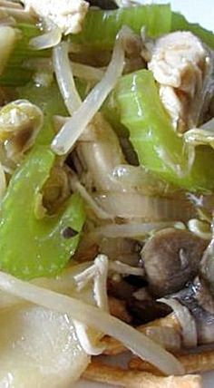 a white plate topped with noodles and mushrooms