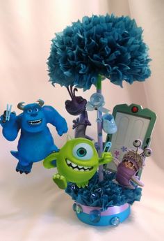 a blue flower pot with monsters in it