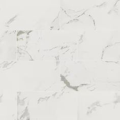 white marble tiles with different shades and sizes