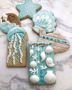 cookies decorated with sea shells and seashells on a table