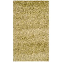 an area rug that has been made with various colors and textures, including light green