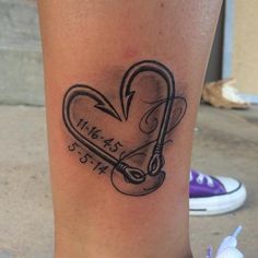 a tattoo on the leg of a woman with a heart and key to her chest