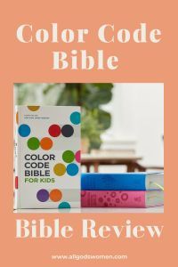 the color code bible is sitting on top of a table next to some colorful books