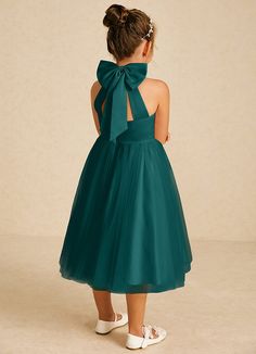 Dora features a charming A-line silhouette in matte satin and tulle, with a stylish halter neckline and playful bows. Sleeveless and easy to wear with a zipper back, it’s perfect for adding a touch of elegance to any special occasion. Peacock Flower Girl Dress, Green Flower Girl Dresses, Tea Length Flower Girl Dress, Girl Green Dress, Tea Length Tulle, Flower Girl Dresses Blue, Military Ball Dresses, Sage Dress, Special Event Dresses