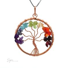 Beautifully wire-wrapped Tree of Life pendant with chakra stones. It comes in a variety of metal color options. Perfect for a chain or a cord! Materials: Mixed Metals with crystals Dimensions: 40mm wide, 52mm long including bail Note: Not Gold, Rose Gold, or .925 Sterling Silver Wire Wrapped Spiritual Crystals As Gifts, Spiritual Wire Wrapped Crystals As Gifts, Multicolor Wire Wrapped Crystal Necklace As Gift, Spiritual Multicolor Wire-wrapped Crystal Necklaces, Spiritual Wire Wrapped Multicolor Crystal Necklaces, Spiritual Multicolor Wire Wrapped Crystal Necklaces, Spiritual Wire Wrapped Crystal Pendant, Multicolor Wire Wrapped Pendant Jewelry, Nature-inspired Wire Wrapped Crystal Pendant Necklaces