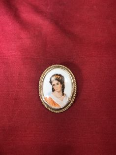 "Lovely brooch/Pendant of a lady on oval porcelain by Limoges, France. Hand painted. Light wear on gold Little over 2\" x 1.5\" Check out other items in our shop by visiting : www.etsy.com/shop/vintagegoldenmoments Import duties, taxes and charges are not included in the item price or shipping charges. These charges are the buyer's responsibility. Please check with your country's customs office to determine what these additional costs will be prior to bidding/buying.These charges are normally co Victorian Style Enamel Pin Gift, White Oval Cameo Brooches, White Oval Brooches For Gifts, White Vintage Cabochon Brooches, 1940s Jewelry, Aztec Calendar, Porcelain Jewelry, Green Jewelry, Limoges France