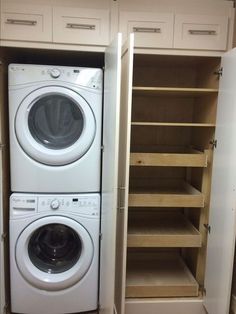 a washer and dryer are in the closet