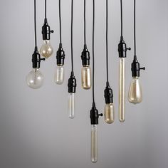 an assortment of light bulbs hanging from the ceiling