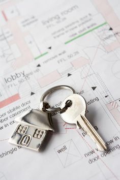 a house key on top of architectural drawings royalty images and stock photos for real estate agent or homeownership