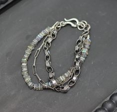 This is a three strand bracelet. It features two different sterling silver chains and one strand of gemstone beads. It's like having three bracelets in one! This one features flashy grey labradorite in a 4.5mm size square heishi for some extra sparkle. This will take a few extra days to ship as I finish these to order. ♦Length: Adjustable 7.25 to 8.5 inches, I can make this smaller if you need. Please just add a note at checkout and give me a few days to make the adjustments before shipping. Mak Silver Double Strand Beaded Bracelets With Gemstones, Silver Double Strand Bracelet With Natural Stones, Silver Double Strand Bracelets With Gemstone Beads, Silver Multi-strand Bracelet With Gemstone Beads, Silver Multi-strand Bracelet With Natural Stones, Three Strand Bracelet, Lapis Pendant, Multi Strand Bracelet, Silver Chains