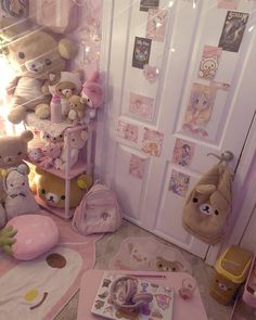 a room filled with lots of stuffed animals next to a wall covered in pink decorations