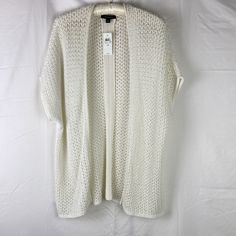 Short Sleeve Crocheted White Cardigan By Ann Taylor Open Front Style 100% Cotton New Condition, Togas In Tact, No Flaws Or Snags Color Is Tricky To Photograph But It Is Consistent Throughout Ships Same Or Next Day Thank You For Stopping By :) Casual Open Knit Cardigan For Daywear, White Oversized Open Front Top, White Open Front Knitted Sweater, Open Knit Sweater For Daywear, White Pointelle Knit Outerwear, White Textured Knit Cardigan For Layering, White Open Knit Sweater With Open Front, Casual White Pointelle Knit Cardigan, White Textured Knit Outerwear