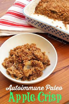 an apple crisp in a bowl next to a casserole dish on a wooden table