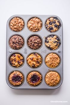 a muffin tin filled with blueberry crumbles and oatmeal