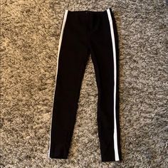 Brand New Black Leggings From Zara With White Solid Stripe Down Each Side. Stretch Black Pants With Contrast Stripes, Black Stretch Pants With Contrast Stripes, Trendy White Bottoms With Contrast Stripes, Trendy Fitted Black And White Bottoms, Black Stretch Bottoms With Contrast Stripes, Black Bottoms With Contrast Stripes And Stretch, Fitted Black Pants With Contrast Stripes, Trendy Stretch Zara Leggings, Zara Black Sporty Bottoms