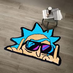 a rug with a cartoon character wearing sunglasses on the floor next to a coffee table