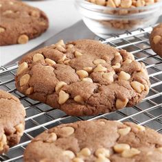 cookies cooling on a wire rack with nuts