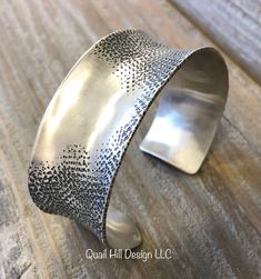 "This cuff is heavy 16 gauge Argentium sterling silver, hand forged and textured.  The wide and Chic cuff has a patina and an elegantly brushed finish.  Not adjustable.  -6 7/8\" total inside circumference  -1\" wide -16 gauge  -  All items will be sent with a signature requirement- if you do not want this service please send me a note at checkout, but please understand that I cannot refund an unsigned for package if it has been lost to parcel bandits.  in the United States, just choose \"free shipping\". Thank you! MEASURING FOR A CUFF BRACELET: The best way to get a good fit is to measure a cuff bracelet you already have that fits you well and look for a bracelet with those dimensions.  The total inside circumference is the inside circumference of the bracelet from end to end PLUS the ga Luxury Antique Sterling Silver Cuff Bracelet, Elegant Adjustable Cuff Bracelet With Patina, Elegant Adjustable Patina Cuff Bracelet, Elegant Silver Bracelets With Patina, Elegant Silver Patina Bracelets, Silver Cuff Bracelet With Patina As Gift, Silver Patina Cuff Bracelet As A Gift, Silver Hammered Cuff Bracelet, Modern Silver Cuff Bracelet With Oxidized Finish