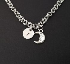 Personalized Antique Silver Moon Bracelet!  A three dimensional crescent moon charm on a lovely chain bracelet makes the perfect gift for you or your best friend.The moon bracelet charm is made from zinc alloy and measures 13 mm.  The bracelet is high quality zinc alloy and measures 8.5".  The moon charm bracelet can be personalized with a .5" silver plated disc stamped with the initial of your choice.  The charm and initial disc are connected to the bracelet with sturdy split rings that will ne Adjustable Personalized Moon-shaped Jewelry, Personalized Adjustable Moon Shaped Jewelry, Silver Metal Bracelets With Moon Charm, Silver Metal Bracelet With Moon Charm, Metal Charm Bracelet With Moon Charm As A Gift, Celestial Charm Bracelet With Moon Charm As A Gift, Celestial Bracelet, Bible Verse Bracelet, Best Friend Bracelet