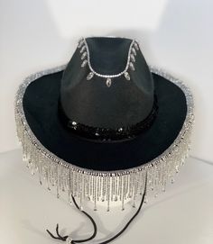 Custom rhinestone strass tassel fringe cowboy / cowgirl felt hat. Choose from Black or White base hat. Next choose Gold, Rose Gold, Silver, Silver AB Teardrop or Silver Teardrop trim. Trim color choice will correspond to rhinestone detail on crown, I.e Gold trim choice will have matching Gold rhinestone detail at the top of hat. A coordinating sequin hatband completes this ultra glam cowboy hat. Perfect for festivals, birthdays, bachelorette, or costume parties..I also offer completely custom or Western Hat Bands With Rhinestones For Rodeo, Western Hats With Bling For Rodeo, Western Bling Hat For Rodeo, Western Style Bling Hats For Rodeo, Western Party Hat With Rhinestone Fringe, Western Style Adjustable Hat With Rhinestone Fringe, Adjustable Festival Hats With Rhinestone Fringe, Western Wide Brim Hat With Bling, Adjustable Rhinestone Fringe Hat For Festivals