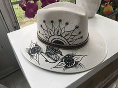 Mexican hand painted hat. The hat has a colorful floral design. Unique, colorful and fun to wear. The hat is made out of jute and it is light weight. Artisan Hat For Spring Vacation, Artisan Spring Vacation Hat, Whimsical Short Brim Vacation Hats, Artistic Adjustable Straw Hat For Spring, Whimsical Summer Fedora With Short Brim, Whimsical Short Brim Fedora For Summer, Whimsical Curved Brim Fedora For Beach, Handmade Artisan Panama Hat For Spring, Artisan Handmade Panama Hat For Spring