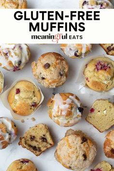 gluten - free muffins with icing and cranberries on top