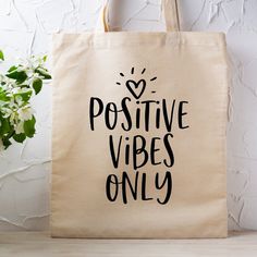 Our "Positive Vibes Only" Tote Bag – is a stylish and meaningful accessory that goes beyond fashion. This tote bag isn't just about carrying your essentials; it's a statement of positivity and a reminder to make a difference in the world. Explore the versatility of our 100% cotton canvas tote bags featuring a powerful inspirational message – an ideal choice for your daily activities! These attractive natural canvas shopping bags are handy for spontaneous grocery store trips, gym sessions, Bible Positive Vibes Only, Print Decals, Canvas Shopping Bag, Holidays With Kids, Inspirational Message, Good Vibes Only, Fresh Produce, Daily Activities, Shopping Bags