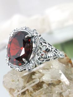 Garnet Ring Formal Oval Ruby Ring With Stone Setting, Classic Oval Crystal Ring With Stone Setting, Classic Oval Crystal Ring For Gift, Elegant Large Stone Ruby Ring Gift, Elegant Ruby Ring With Large Stone For Gift, Oval Rings With Stone Setting As A Gift, Elegant Large Stone Ruby Ring, Classic Oval Rings With Stone Setting, Formal Oval Rings With Stone Setting