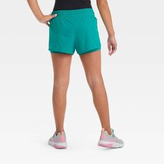 Why we're ALL IN: 2-in-1 shorts made with soft and stretchy fabric to help keep them comfortable through a range of activities, from running to sports practice and casual hangs. A full waistband elastic with drawcord closure makes for a stay-put fit, while a loose fit silhouette offers greater range of motion. All in Motion™: Made for every move, priced for every day. All In Motion, Turquoise Green, Fabric Tape, Range Of Motion, Stretchy Fabric, Body Measurements, Girls Shopping, Shoe Laces, Active Wear