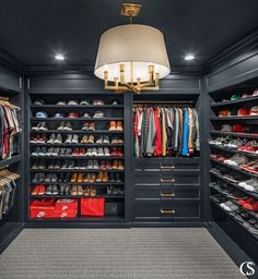 a walk in closet filled with lots of shoes