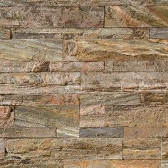 a stone wall that is made out of different types of stones and has various colors