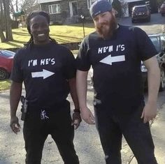 two men standing next to each other in front of a house wearing t - shirts that say i'm he's