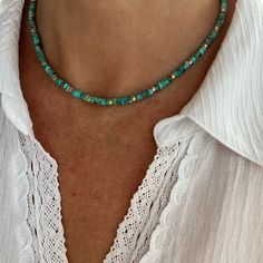 "This flattering yet simple dainty necklace is made with small 4mm high quality genuine AAA grade Kingman Arizona turquoise heishi beads, and your choice of either gold filled or sterling silver spacer beads. The kaleidoscope of blues and greens is a perfectly balanced and mixed throughout the necklace. These stones are gorgeous shades of the greenish blue and green with light brown matrix. They are perfectly calibrated with a superior cut featuring straight edges, and a fine low gloss polish. - Kingman Arizona, Heishi Necklace, Necklace Womens, Necklace Extender, Arizona Turquoise, Straight Edges, Greenish Blue, Beading Wire, Heishi Beads