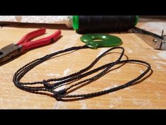 a pair of pliers and other tools on a table