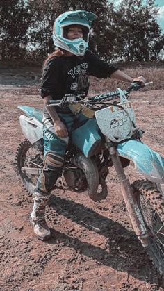 a person on a dirt bike in the dirt